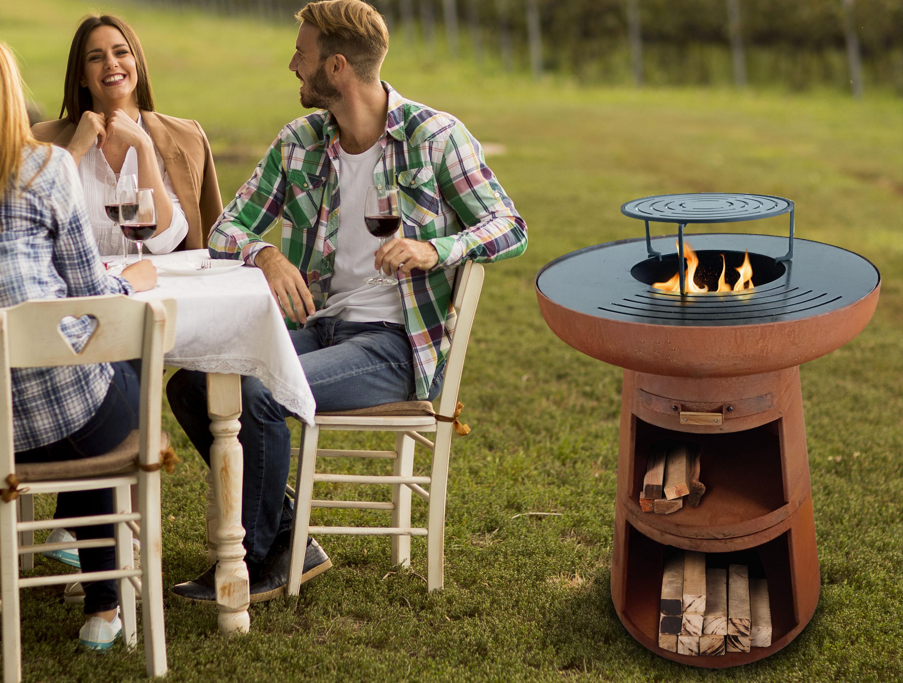 Barbecue rotondo con piastra rotonda in acciaio e griglia in acciaio corten
